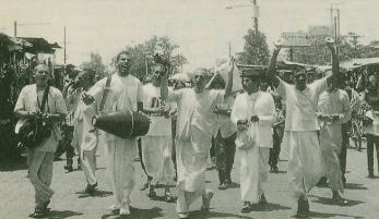 Bhakti Abhay Carana Swami leads in Kirtan