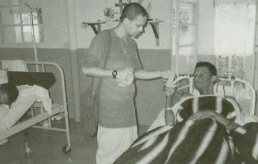 Devotee Delivers Krsna Prasadam To patient