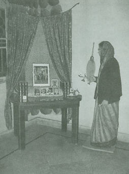 Devotee Offers Aarti to Krsna