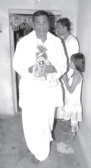 Caitanya Carana during the installation of Deities in his house